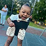 Kaiomi joined the competition — help win amazing prizes! baby, child, toddler, smiling, happy, playground, swing, outdoor, park, infant, portrait, face, person, sitting, motion, summer, daylight, trees, caregiver, playground_equipment