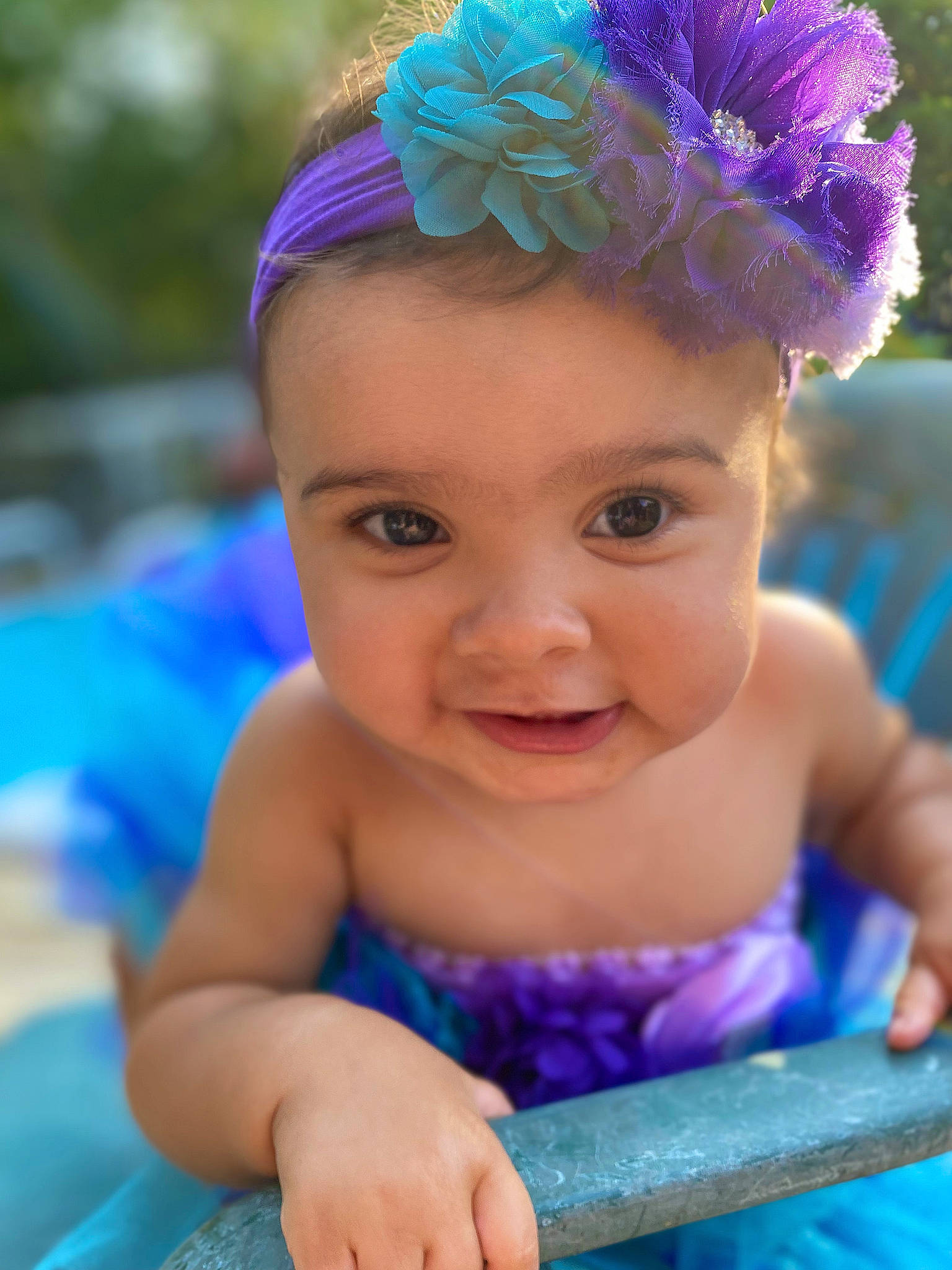 Zayla is registered to the contest to win money with this photo: aqua, azure, baby, baby_toddler_clothing, blue, cap, child, eye, hairstyle, happy, head, iris, organ, person, photograph, pink, plant, purple, skin, smile