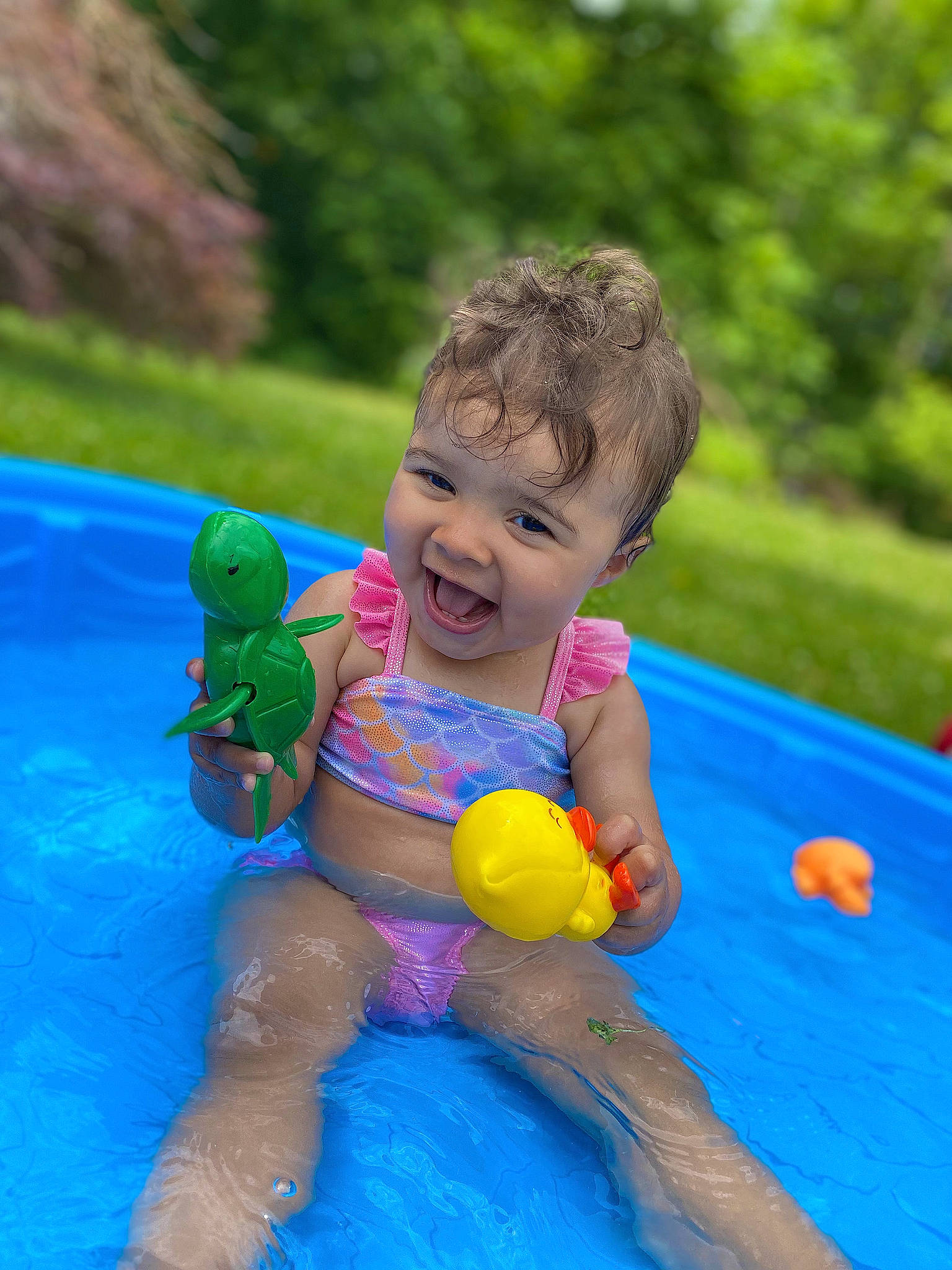 Zayla joined the competition — help win amazing prizes! baby, ball, bathing, child, electric_blue, fun, games, grass, happy, inflatable, leisure, person, plant, play, recreation, sitting, smile, toddler, toy, vacation