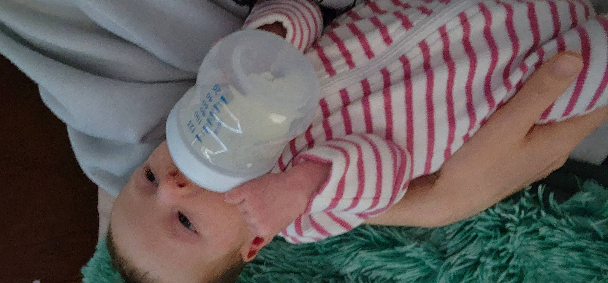 Anastasia is registered to the contest to win money with this photo: baby, baby_bottle, baby_products, baby_toddler_clothing, bottle, child, drink, drinkware, finger, hat, headgear, nail, pattern, person, plastic, plastic_bottle, skin, sleeve, smile, toddler
