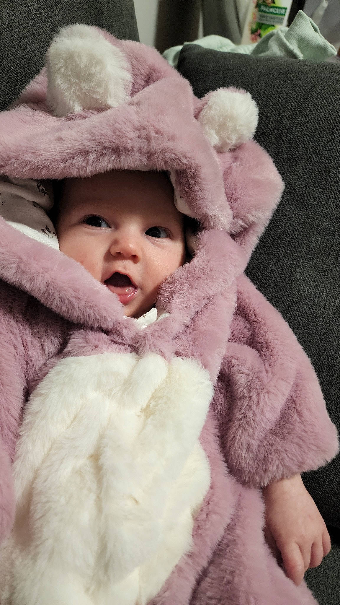 Anastasia is registered to the contest to win money with this photo: baby, baby_toddler_clothing, cap, cheek, child, comfort, eyelash, face, fashion_accessory, fur, fur_clothing, happy, hat, headwear, lip, person, pink, skin, sleeve, toddler
