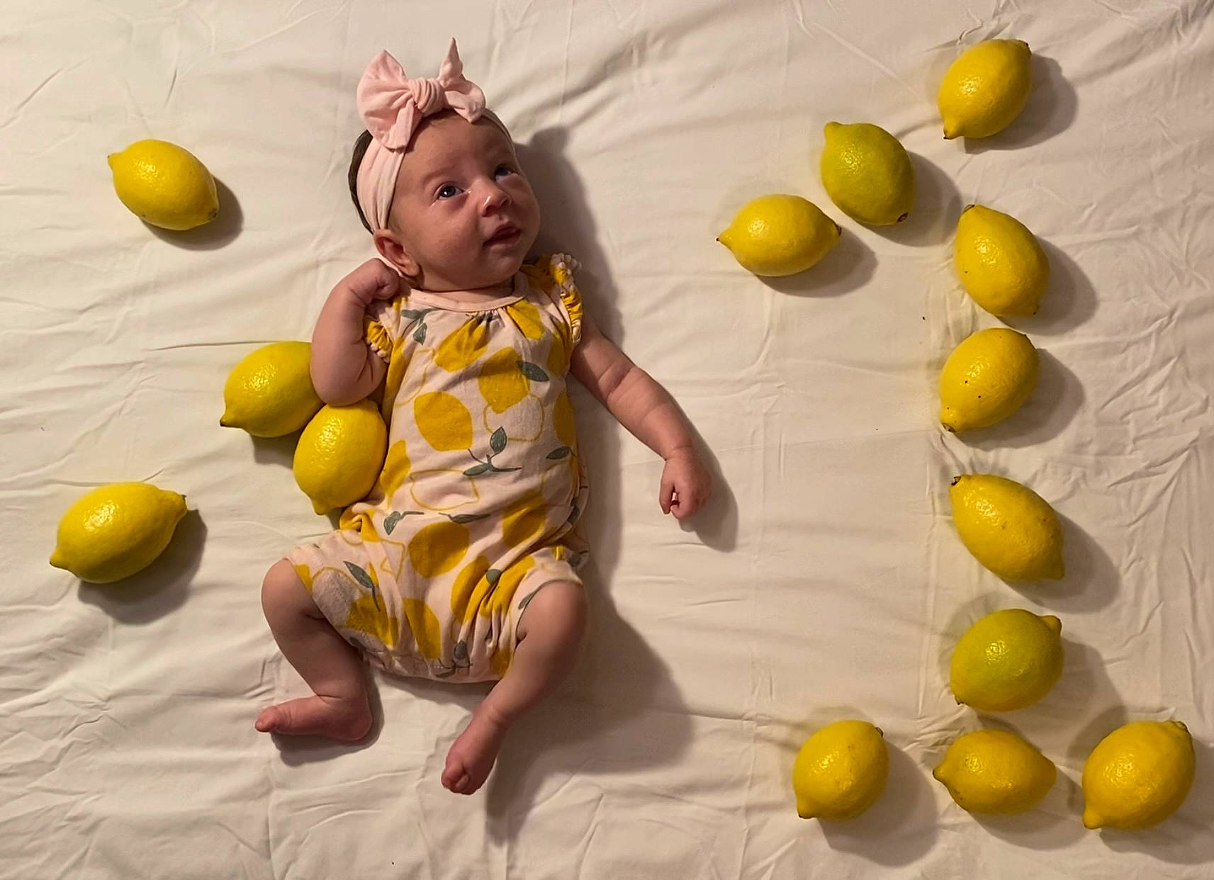 Scarlytt is registered to the contest to win money with this photo: baby, baby_toddler_clothing, baby_toys, barefoot, child, flooring, food, foot, fun, happy, headwear, leisure, natural_foods, person, play, recreation, room, sitting, smile, still_life_photography