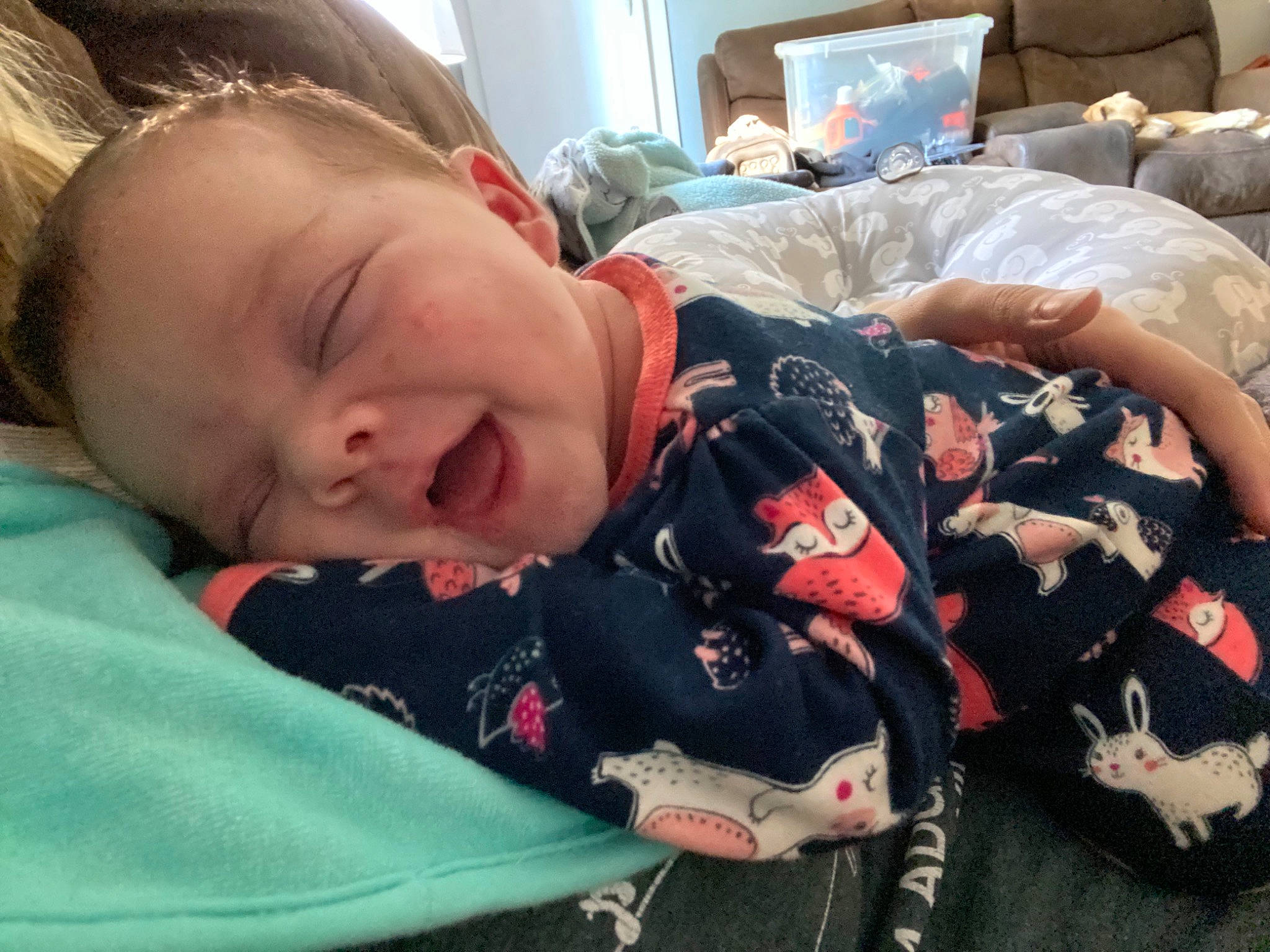 Bella is registered to the contest to win money with this photo: baby, baby_products, bag, bed, bedding, bedtime, child, comfort, couch, lap, linens, luggage_and_bags, nap, person, pillow, room, sitting, smile, textile, toddler