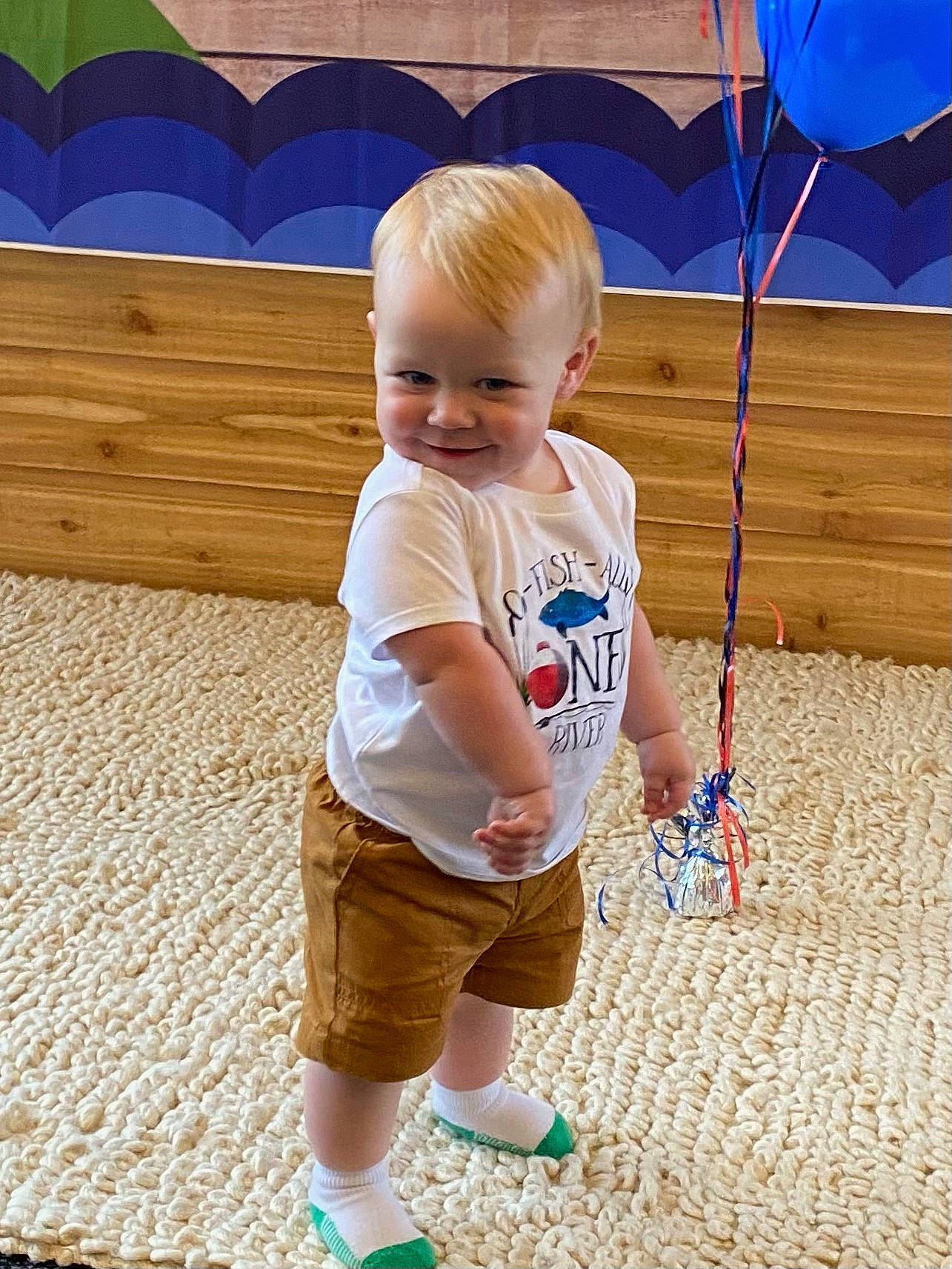 River James joined the competition — help win amazing prizes! baby, baby_toddler_clothing, blue, child, electric_blue, flooring, fun, grass, happy, joy, leisure, line, mammal, person, recreation, shorts, sleeve, standing, summer, t_shirt