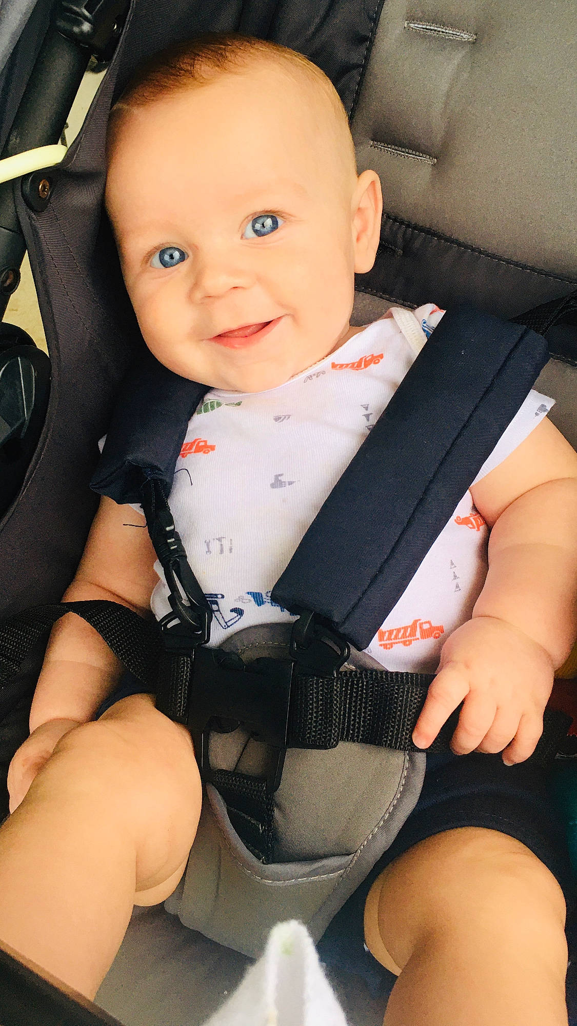River James joined the competition — help win amazing prizes! baby, baby_carriage, baby_in_car_seat, baby_toddler_clothing, black, cheek, comfort, face, finger, human_body, joy, knee, leg, person, product, seat_belt, skin, sleeve, smile, thigh