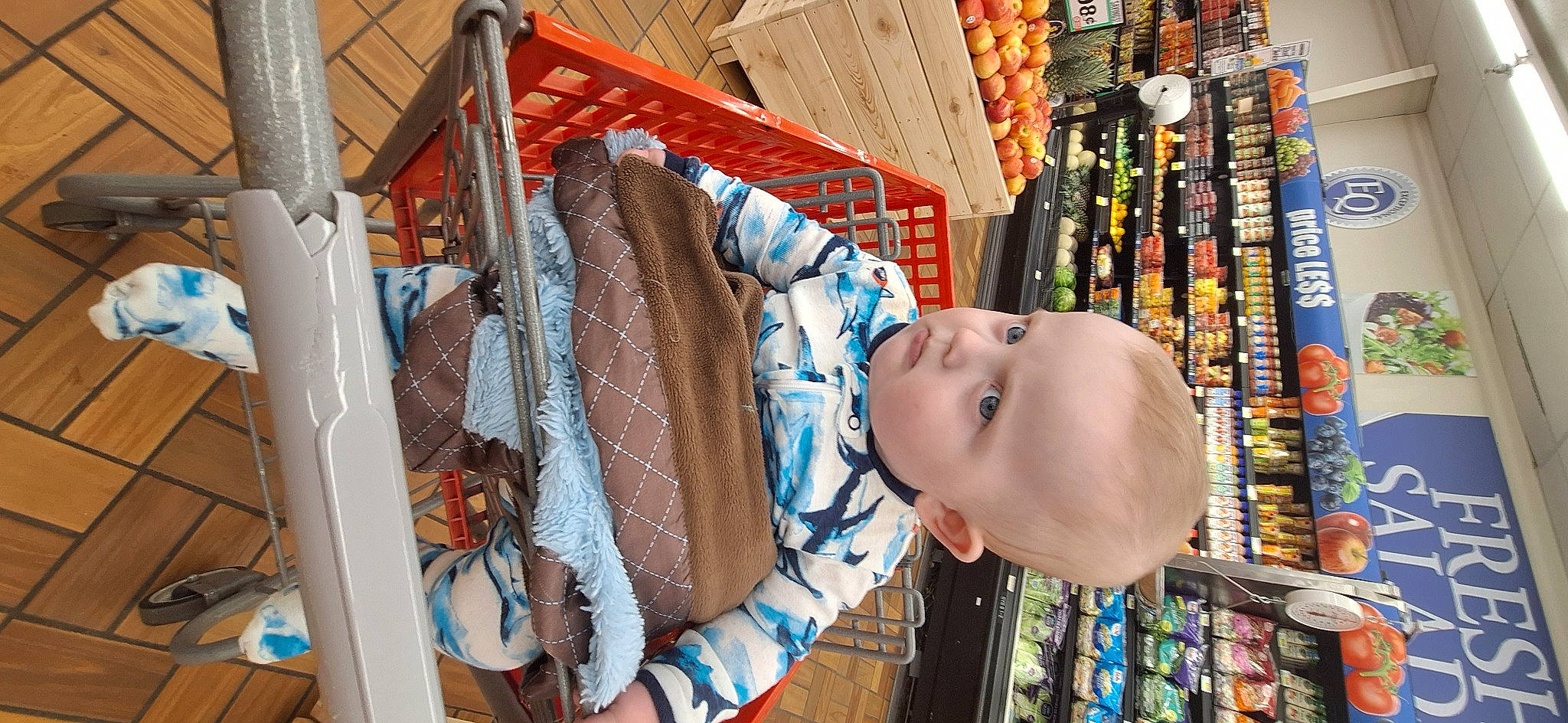 Phoenix is registered to the contest to win money with this photo: baby, baby_products, baby_toddler_clothing, building, child, city, convenience_store, customer, fun, person, retail, room, shelf, shelving, textile, toddler, vacation, wood