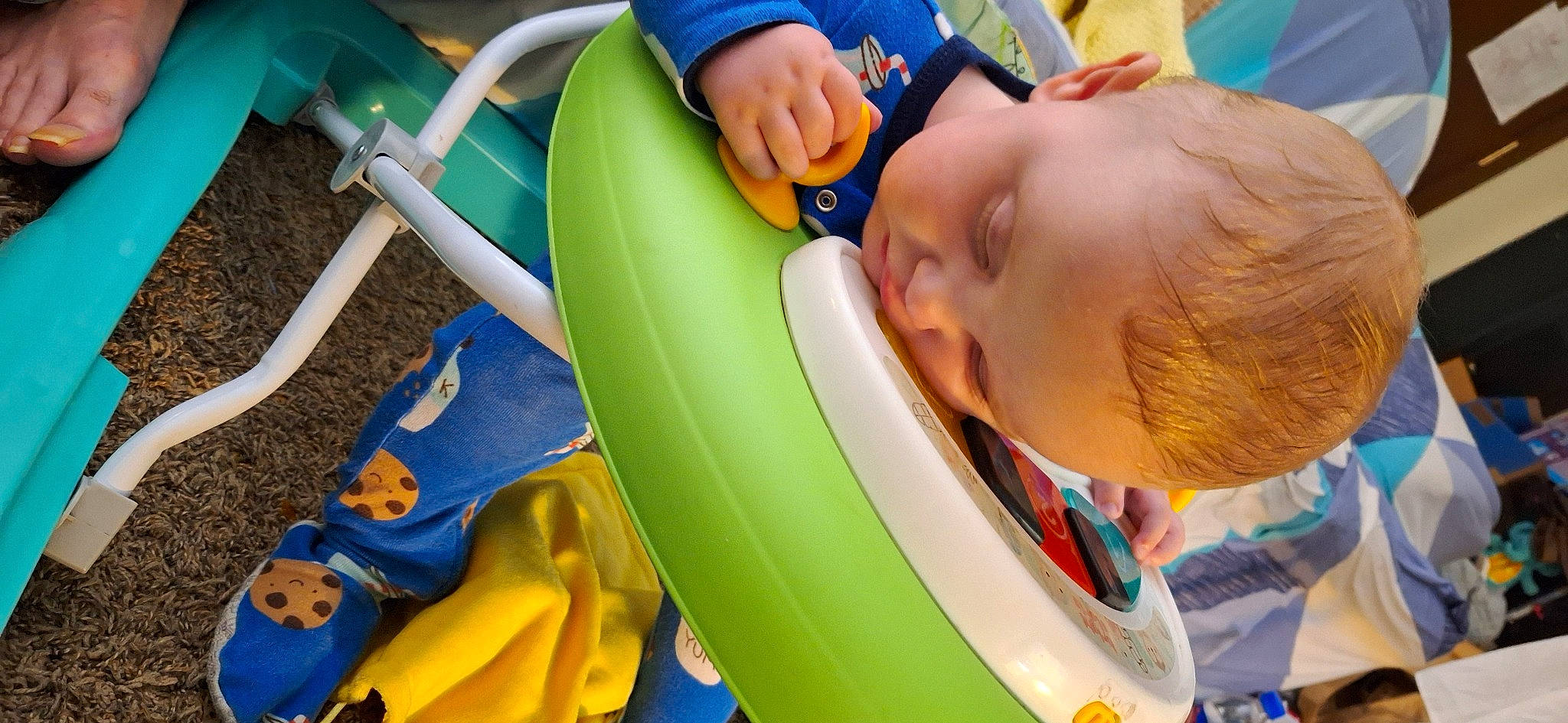 Phoenix is registered to the contest to win money with this photo: baby, baby_playing_with_toys, baby_products, blue, chair, child, electric_blue, fun, games, happy, leisure, outdoor_play_equipment, person, personal_protective_equipment, plastic, play, recreation, toddler, toy, vacation