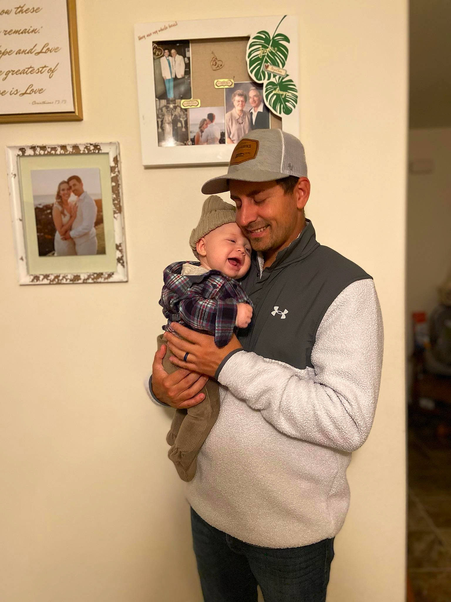 Tito is registered to the contest to win money with this photo: art, art_exhibition, art_gallery, baseball_cap, blurred, cap, event, exhibition, fur, hat, head, headgear, headwear, hug, illustration, joy, person, picture_frame, room, smile