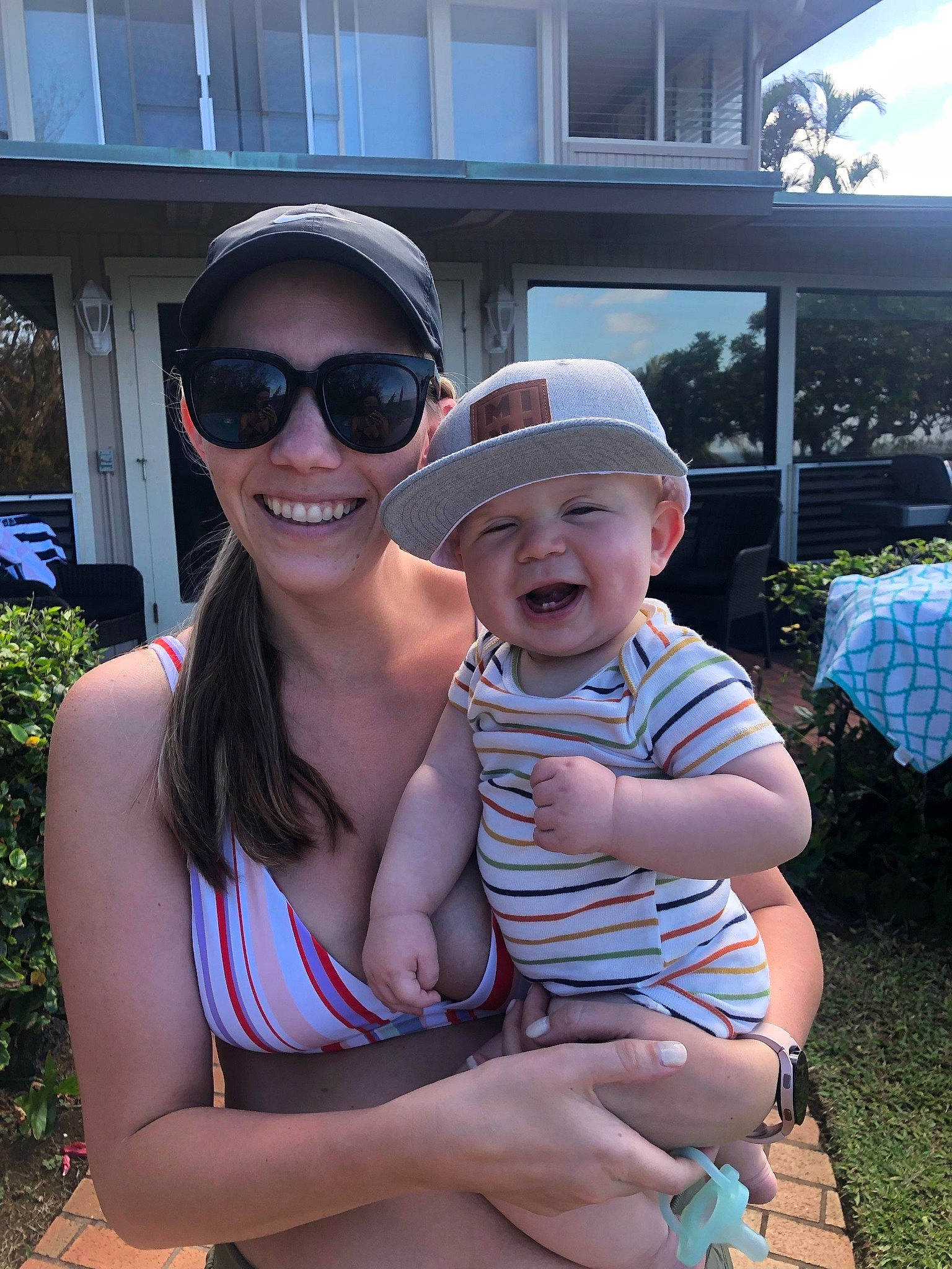 Tito is registered to the contest to win money with this photo: baby, baby_toddler_clothing, baseball_cap, event, eyewear, fun, glasses, goggles, grass, happy, hat, headwear, joy, leisure, person, plant, recreation, smile, sunglasses, toddler