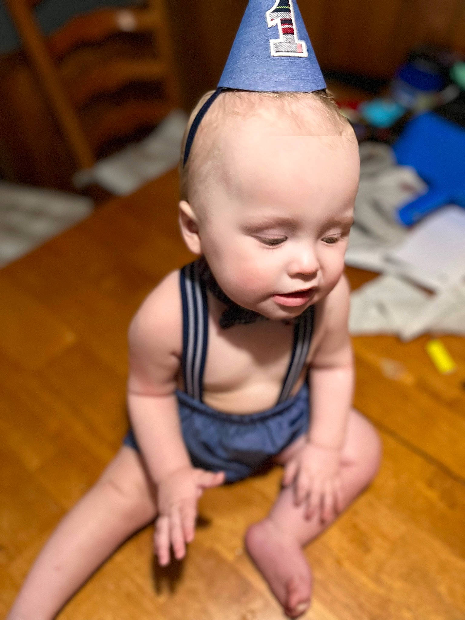 Walter joined the competition — help win amazing prizes! baby, baby_toddler_clothing, cheek, cone, costume_hat, facial_expression, finger, floor, flooring, hairstyle, happy, hardwood, head, leg, mouth, party_hat, person, skin, toddler, vertebrate