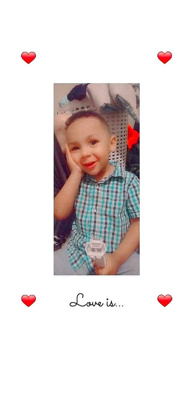 Nico is registered to the contest to win money with this photo: child, design, electric_blue, fashion_accessory, font, gesture, happy, joy, magenta, neck, pattern, person, pink, plaid, play, red, shirt, sleeve, smile, stock_photography