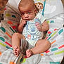 Hudson joined the competition — help win amazing prizes! baby, infant, child, mickey_mouse, onesie, baby_seat, colorful, pattern, monkey, toy, feet, hand, sitting, cute, indoors, face, expression, clothing, person, portrait