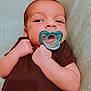 Hudson joined the competition — help win amazing prizes! baby, pacifier, infant, brown_clothing, blanket, lying_down, skin, face, hands, fist, cute, newborn, child, young, portrait, indoors, soft_texture, sleepwear, calm, resting