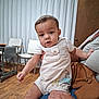 adult, animal_print, baby, casual, chair, child, clothing, curtains, cute, door, furniture, hand, holding, indoor, person, portrait, romper, room, sitting, wooden_floor