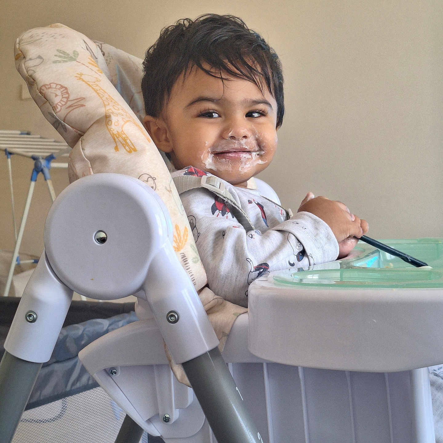 Behrouz joined the competition — help win amazing prizes! baby_clothes, child, cute, eating, face, feeding_time, food_on_face, furniture, happy, high_chair, home, indoor, person, playpen, seatbelt, smile, table, toddler, utensil, young_child