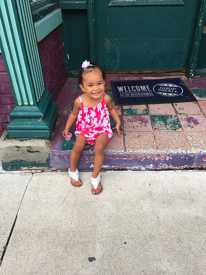 T'Yanna is registered to the contest to win money with this photo: child, cool, day, design, fun, girl, joy, leg, pattern, pink, play, red, sitting, skin, smile, snapshot, standing, summer, toddler, vacation