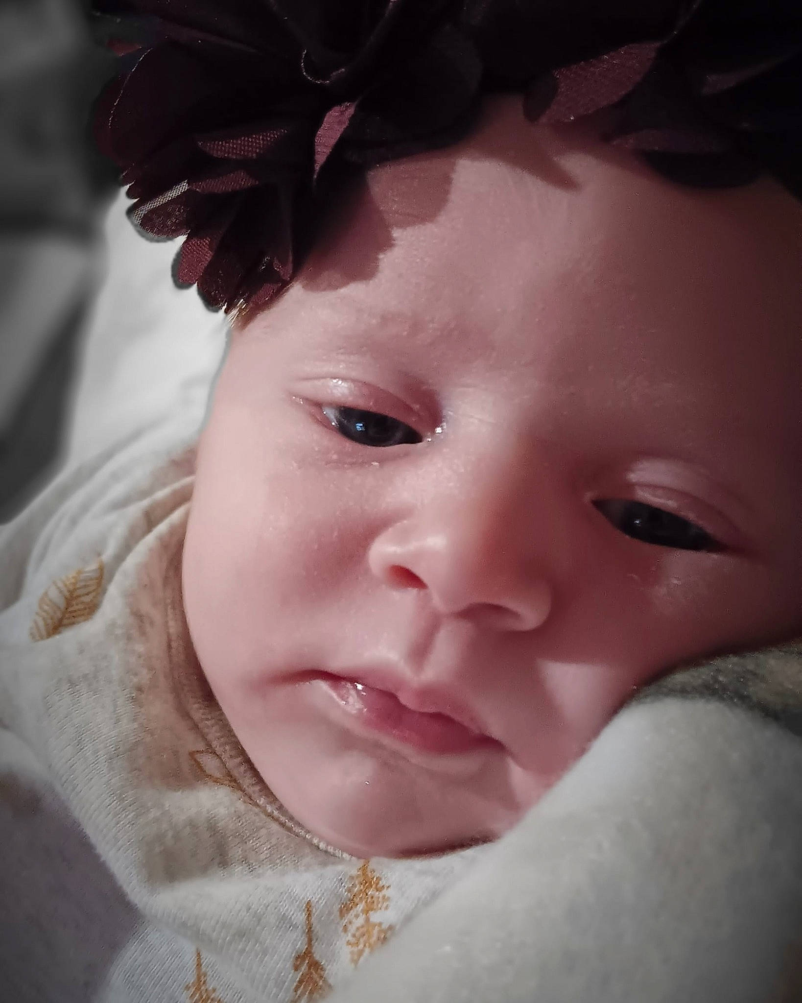 Aurora is registered to the contest to win money with this photo: baby, cheek, close_up, ear, eye, eyebrow, eyelash, flash_photography, happy, head, headgear, headpiece, iris, lip, nose, person, petal, pink, skin, smile