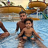 boys, child, colorful, curly_hair, family, fun, happy, leisure, outdoor, playful, pool, recreation, sitting, summer, sunset, swimming, vacation, water, water_park, water_slide