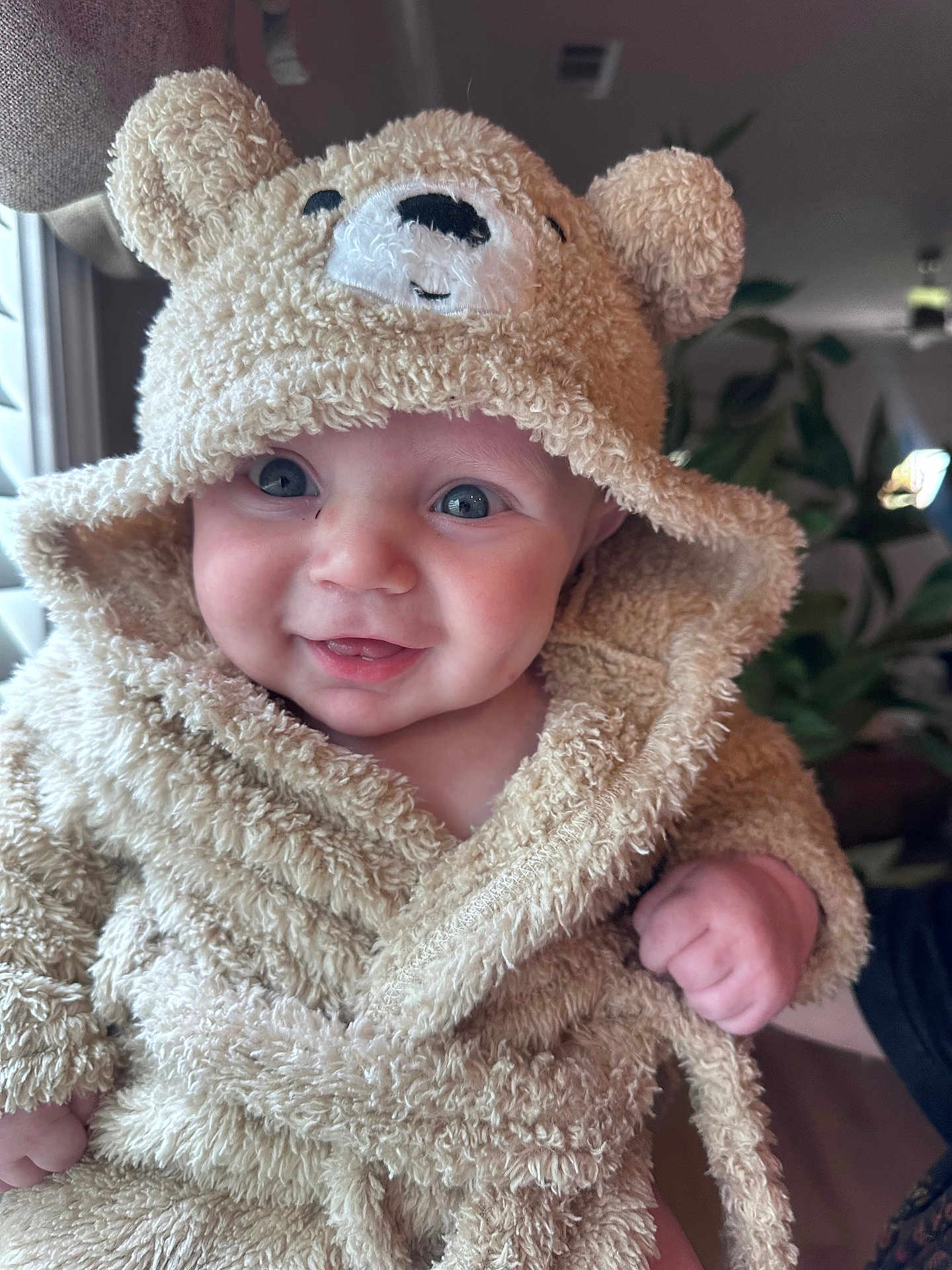Kayson is registered to the contest to win money with this photo: baby, child, smiling, hooded_robe, teddy_bear_ears, blue_eyes, cute, happy, indoor, portrait, fuzzy_texture, cozy, person, infant, apparel, close_up, human_face, baby_clothing, warm, soft
