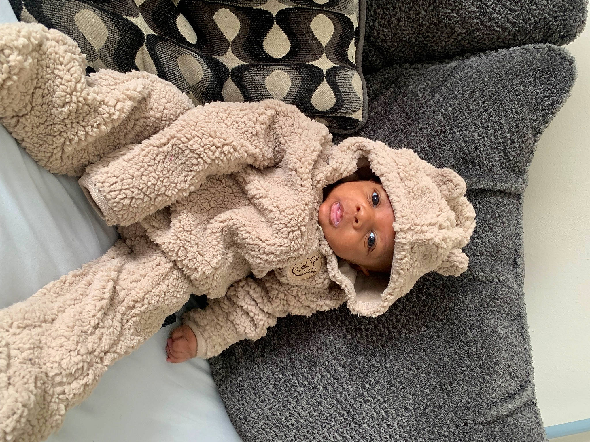 Zayvion joined the competition — help win amazing prizes! baby, baby_sleeping, baby_toddler_clothing, bedding, comfort, flooring, fur, gesture, grey, hand, headwear, linens, pattern, person, photograph, room, sleeve, textile, toddler, white