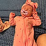 Everleigh is registered to the contest to win money with this photo: baby, sleeping, pacifier, pink_clothing, headband, onesie, patterned_blanket, infant, sleep, cute, child, peaceful, resting, hands_up, soft_lighting, indoor, portrait, baby_girl, fabric, cozy