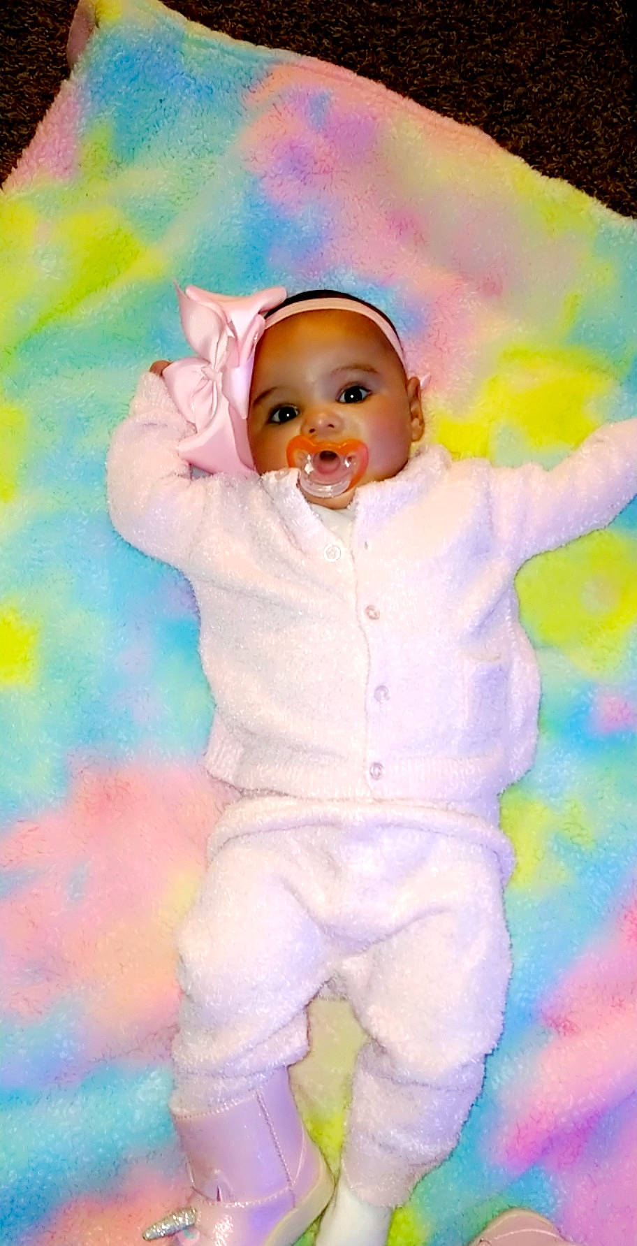 Venus is registered to the contest to win money with this photo: art, baby, baby_toddler_clothing, cheek, eye, happy, iris, nose, orange, outerwear, paint, people_in_nature, person, pink, product, purple, skin, sleeve, smile, textile