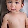 toddler, child, baby, face, blue_eyes, skin, bare_chest, expression, portrait, sitting, curious, young, person, indoors, hair, cute, innocent, closeup, human, head
