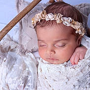 Jasmine joined the competition — help win amazing prizes! baby, sleeping, blanket, basket, headband, flower, pillow, lace, cozy, soft, infant, closeup, peaceful, wrapped, resting, cute, newborn, portrait, indoors, delicate
