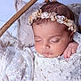 baby, sleeping, blanket, basket, headband, flower, pillow, lace, cozy, soft, infant, closeup, peaceful, wrapped, resting, cute, newborn, portrait, indoors, delicate