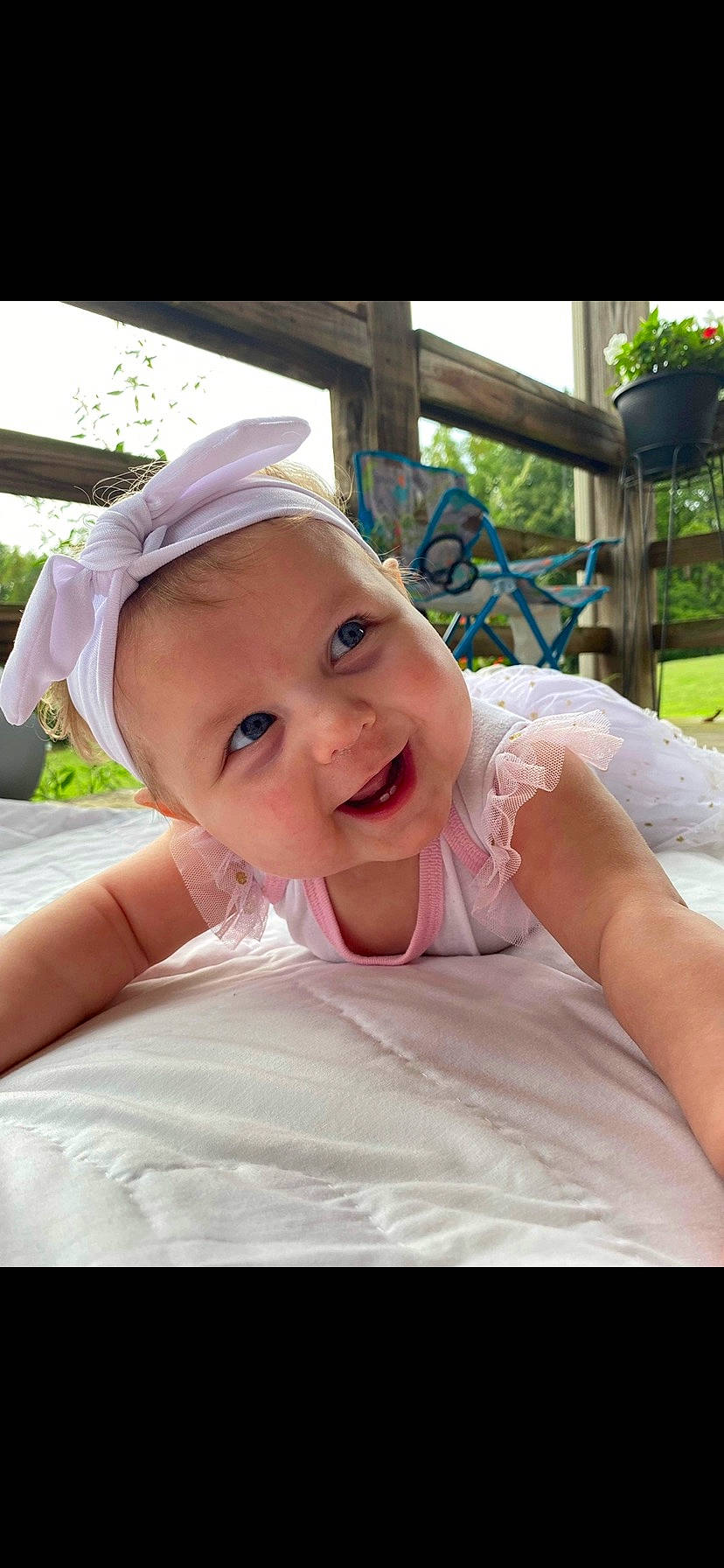 Emberlyn joined the competition — help win amazing prizes! baby, cap, child, event, fashion_accessory, fun, grass, happy, headwear, laugh, leisure, person, pink, plant, portrait_photography, recreation, sitting, skin, smile, toddler