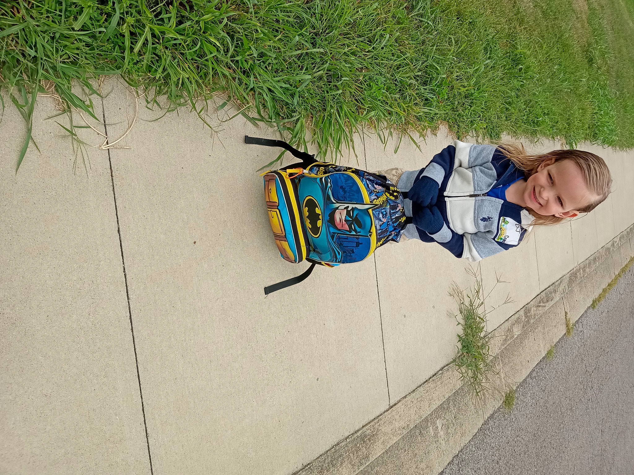 Dennis joined the competition — help win amazing prizes! art, asphalt, child, concrete, electric_blue, fashion_accessory, fun, grass, joy, leisure, pattern, person, plant, recreation, road_surface, shadow, sidewalk, sitting, toddler, tree