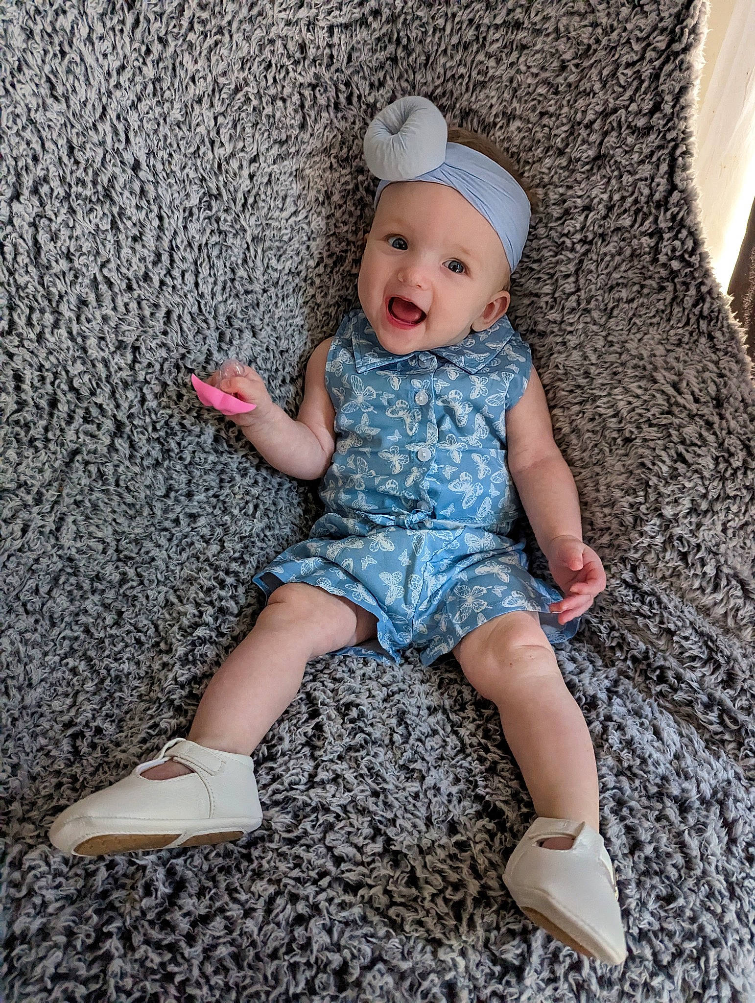 Echo is registered to the contest to win money with this photo: baby, baby_toddler_clothing, cap, child, clothing, dress, eye, foot, fun, happy, head, headwear, human_leg, pattern, person, pink, sitting, skin, sleeve, smile