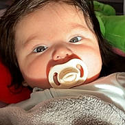 Alix joined the competition — help win amazing prizes! baby, pacifier, blanket, face, infant, closeup, child, indoors, soft_texture, cute, sleeping, comfort, young, portrait, cozy, wrapped, head, skin, hair, expression