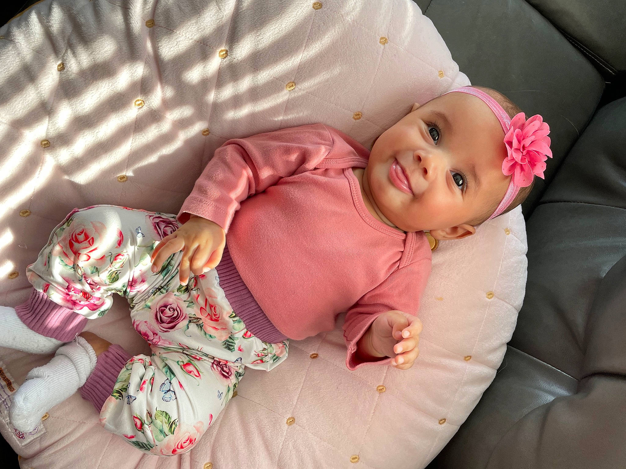 Giovanna is registered to the contest to win money with this photo: baby, baby_products, baby_sleeping, baby_toddler_clothing, cheek, child, comfort, couch, face, finger, head, headwear, joy, linens, pattern, person, pink, sitting, skin, sleeve