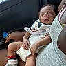 Kaisen joined the competition — help win amazing prizes! baby, sleeping, infant, pacifier, mickey_mouse, bib, socks, car_interior, adult, lap, skin, clothing, hand, seat, window, comfort, nap, peaceful, closeup, portrait