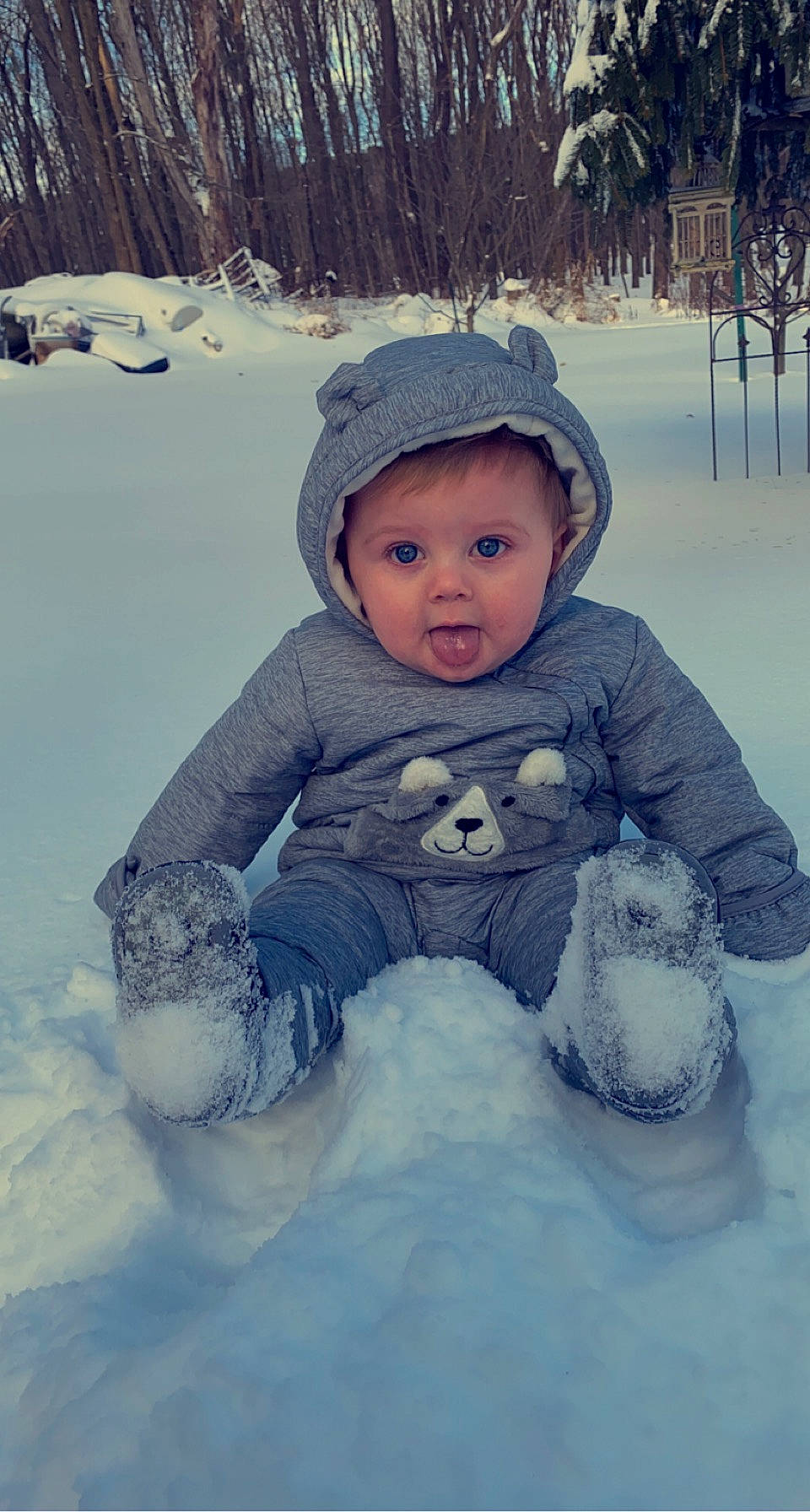 Drew joined the competition — help win amazing prizes! baby, baby_toddler_clothing, beanie, bonnet, cheek, child, freezing, glacial_landform, headwear, hood, hoodie, ice, ice_cap, knit_cap, person, playing_in_the_snow, precipitation, sitting, snow, surprise