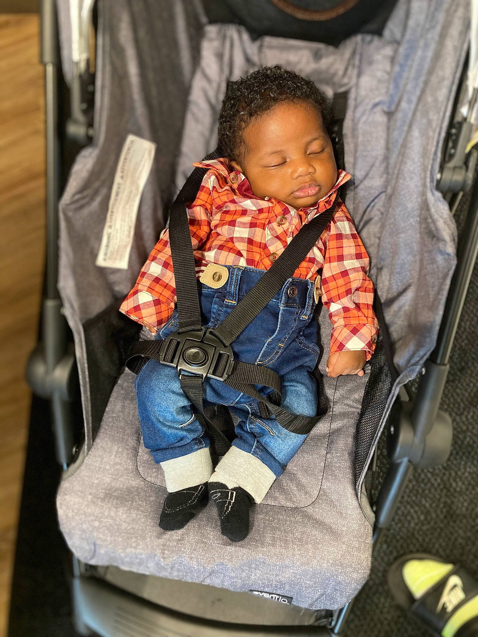 Jamichael joined the competition — help win amazing prizes! baby_carriage, baby_products, bag, car_seat, carmine, chair, comfort, denim, electric_blue, human_leg, outdoor_shoe, passenger, pattern, person, plaid, room, sitting, sock, toddler, travel