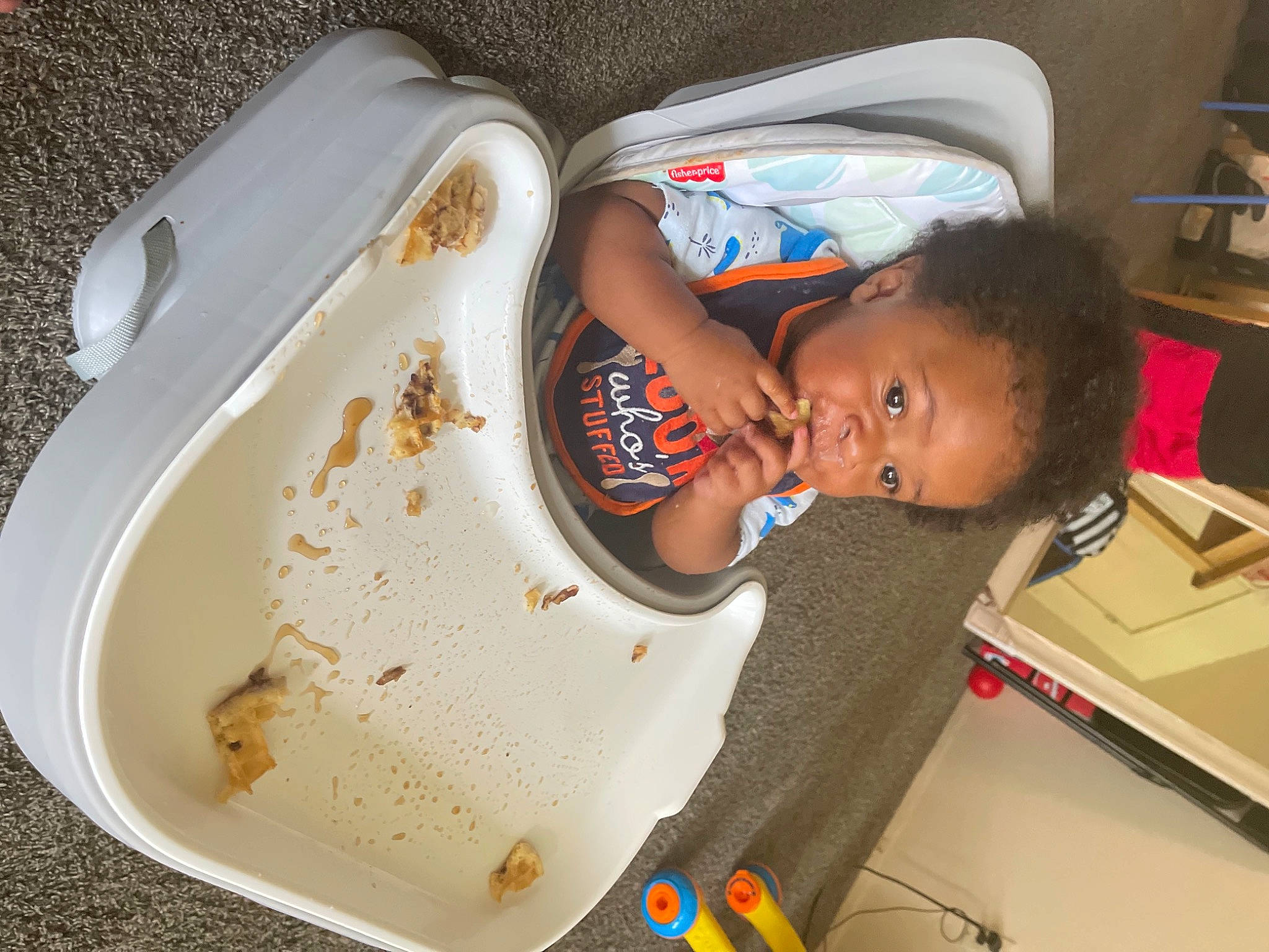 Caysen is registered to the contest to win money with this photo: baby, baby_products, baby_toddler_clothing, child, comfort, comfort_food, dishware, food, fun, person, plate, platter, play, serveware, shelf, shipping_box, t_shirt, toddler
