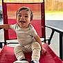 Basilio is registered to the contest to win money with this photo: toddler, child, smiling, happy, red_chair, sitting, shoes, pants, shirt, outdoor, daylight, mesh_chair, baby, cute, portrait, casual_clothing, small_child, fun, joy, young_child