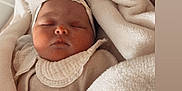 Maria participe au concours pour gagner de l'argent avec cette photo : baby, blanket, child, closeup, clothing, cozy, crown, cute, fabric, face, headband, infant, newborn, peaceful, portrait, resting, sleeping, soft, toddler, warm