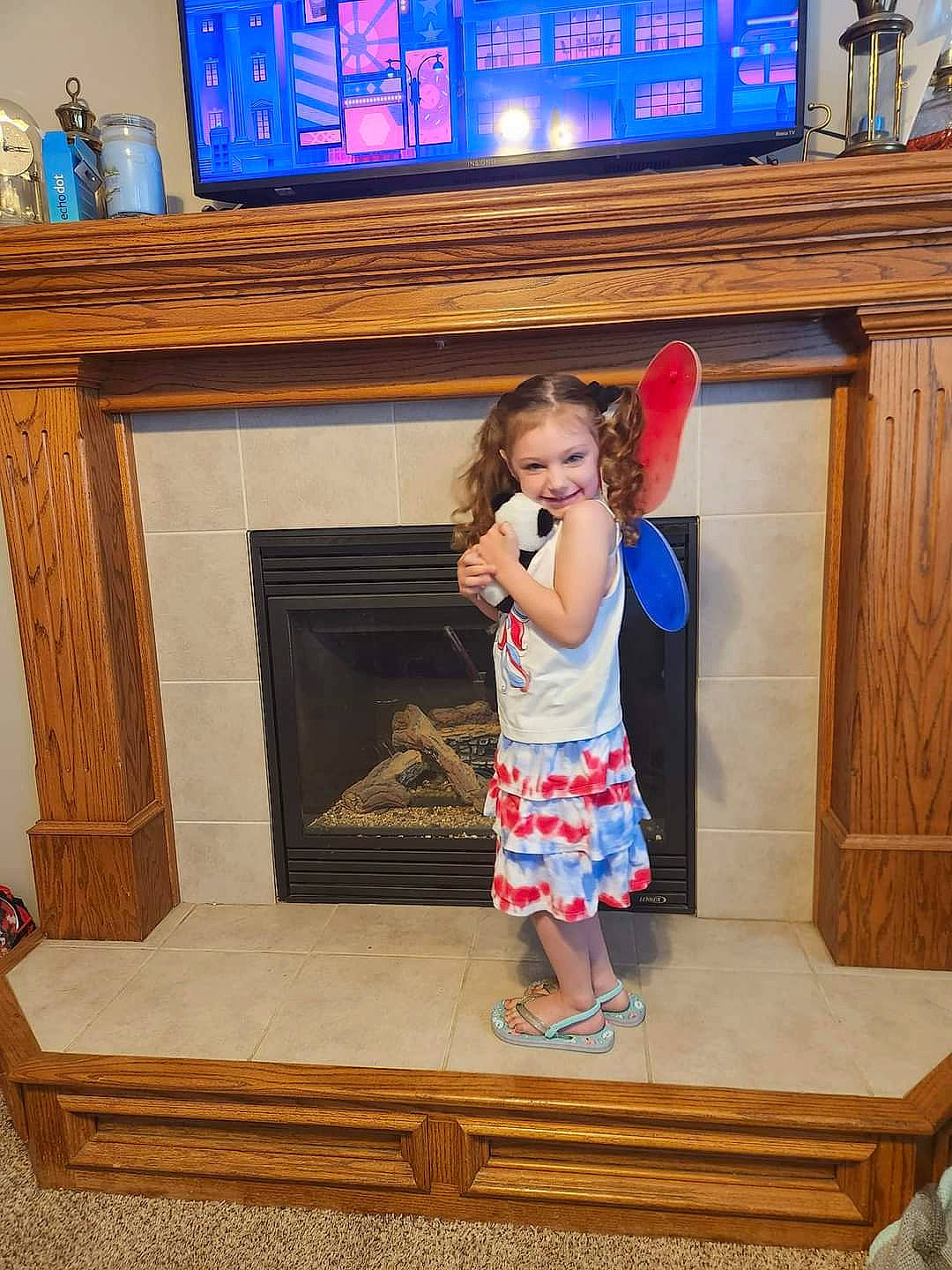 Izabella joined the competition — help win amazing prizes! blue, child, door, electric_blue, floor, flooring, fun, hardwood, home, interior_design, joy, leg, leisure, person, room, sandal, t_shirt, television, toddler, varnish