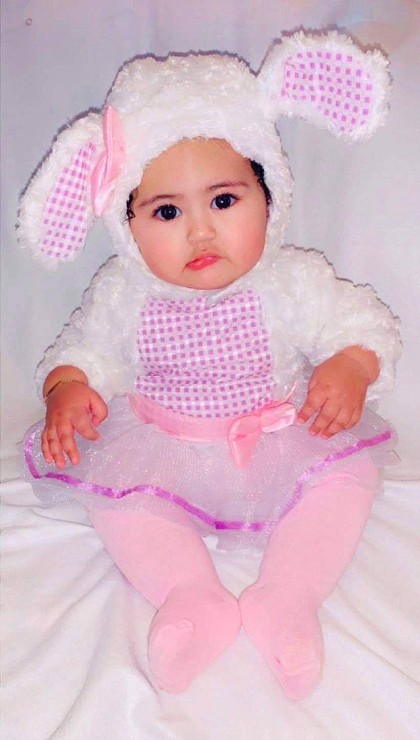 Krystal is registered to the contest to win money with this photo: baby, baby_products, baby_toddler_clothing, brown_hair, child, costume, doll, head, headgear, headwear, person, pink, product, stuffed_toy, toddler, toy
