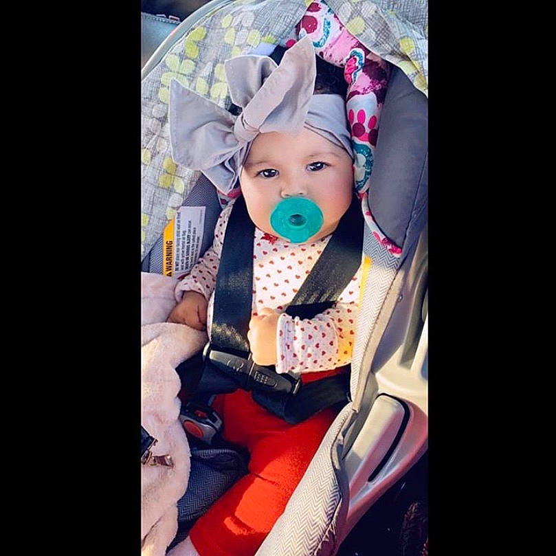 Krystal joined the competition — help win amazing prizes! beauty, car_seat, child, ear, head, headgear, headwear, person, photography, product, toddler
