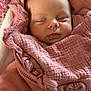 Louane a rejoint le concours — aidez-le/la à gagner de superbes lots ! baby, sleeping, pink, blanket, hoodie, pacifier, face, child, infant, cute, soft_texture, floral_pattern, cozy, warm_clothing, resting, newborn, wrapped, indoors, peaceful, portrait