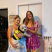 Clover is registered to the contest to win money with this photo: woman, dog, costume, princess, dress, smile, indoor, halloween, pumpkin, door, decoration, pet, party, cute, festival, animal, friendship, celebration, fun, happy
