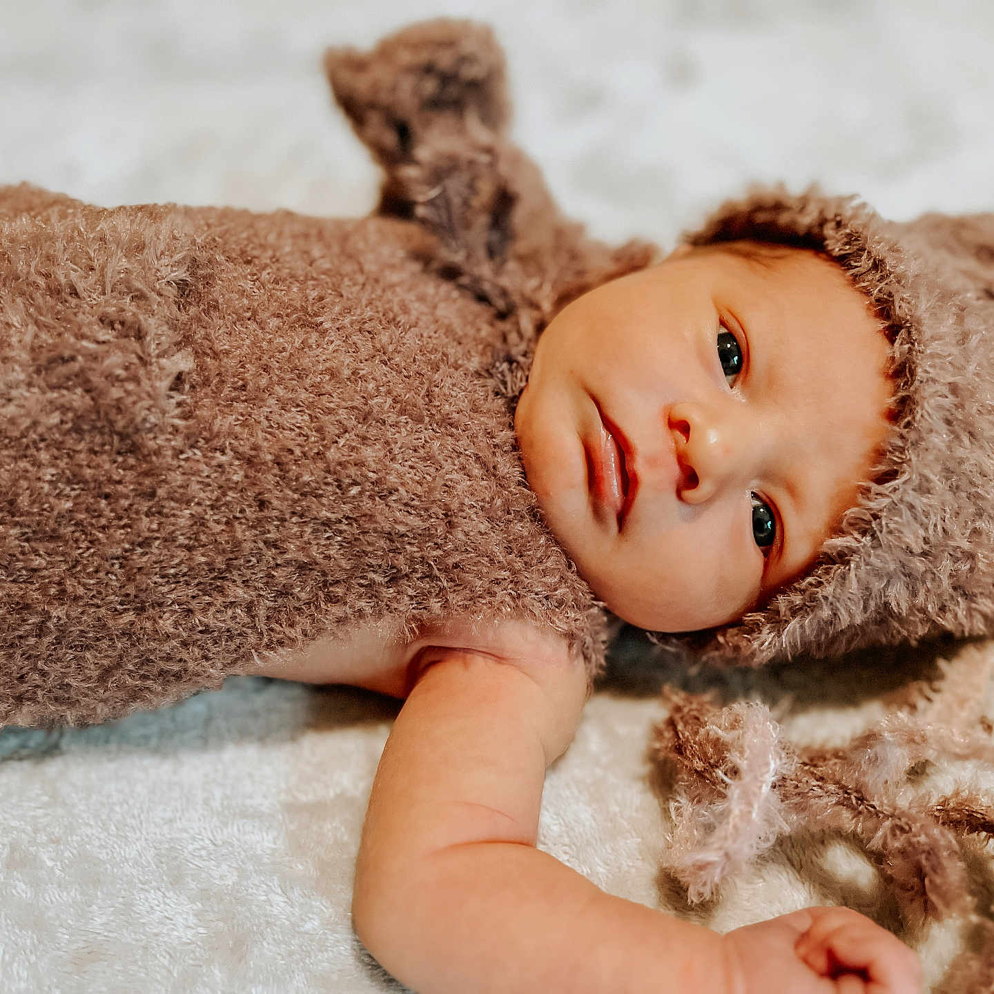 Chloe joined the competition — help win amazing prizes! baby, blanket, bodypart, bonnet, cap, clothing, face, finger, hand, happy, hat, head, hood, newborn, person, photography, portrait, smile, towel, toy