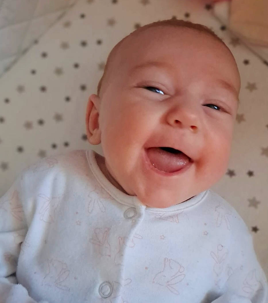 Maddison is registered to the contest to win money with this photo: baby, baby_toddler_clothing, cheek, chin, comfort, eye, eyebrow, face, happy, head, iris, lip, mouth, neck, nose, person, pink, skin, sleeve, smile
