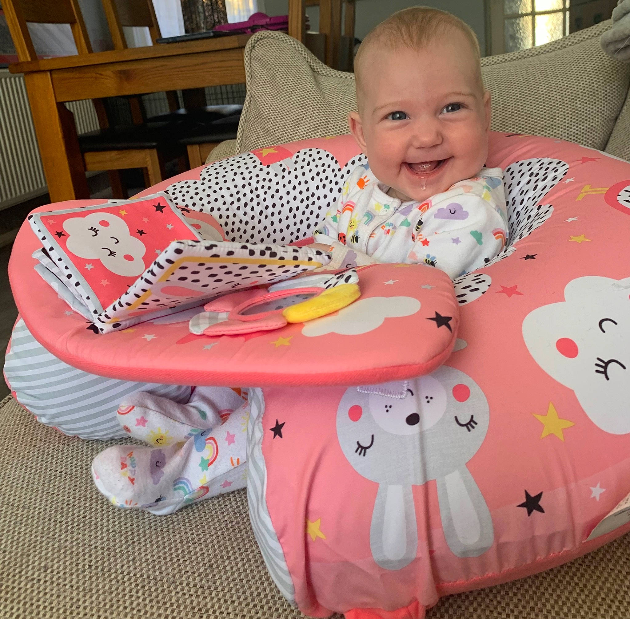Maddison is registered to the contest to win money with this photo: baby, baby_laughing, baby_products, baby_safety, baby_toddler_clothing, baby_toys, chair, child, comfort, fun, furniture, head, joy, lap, linens, pattern, person, play, room, sitting