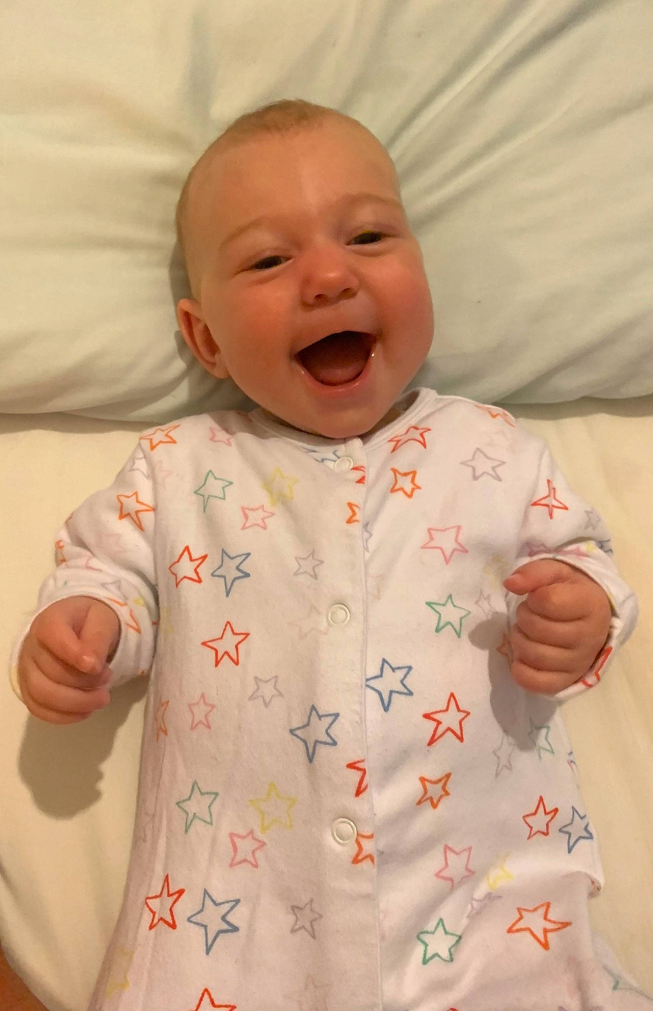 Maddison is registered to the contest to win money with this photo: arm, baby, baby_toddler_clothing, cheek, chin, clothing, comfort, eye, face, facial_expression, gesture, happy, head, lip, mouth, nose, orange, person, skin, sleeve