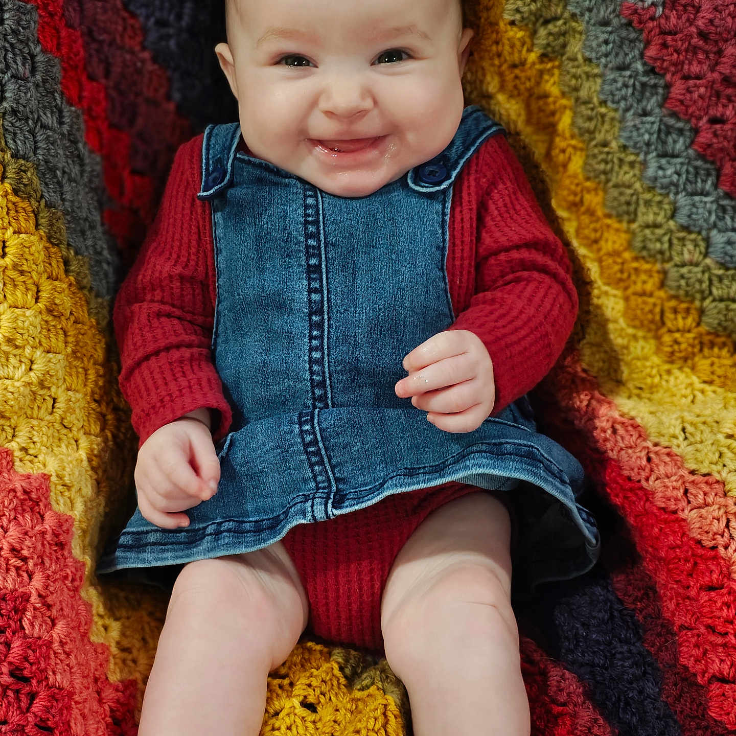 Riplee joined the competition — help win amazing prizes! baby, child, cozy, crocheted_blanket, cute, denim_dress, face, hand, happy, infant, knitting, legs, multicolor, portrait, red_clothing, sitting, skin, smiling, texture, warm